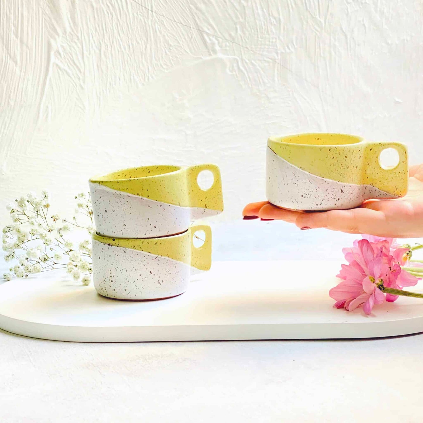 2 yellow espresso cups