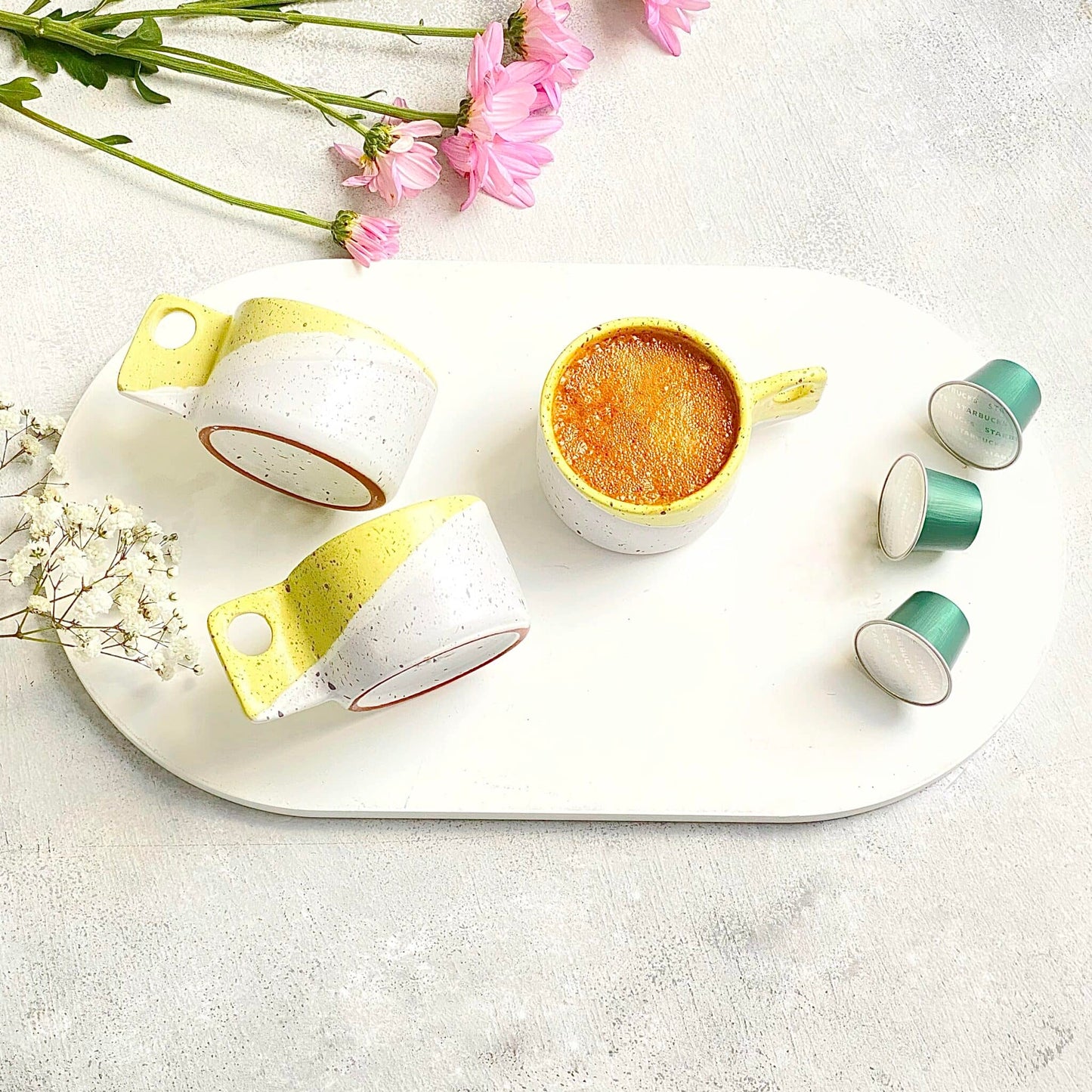 2 yellow espresso cups