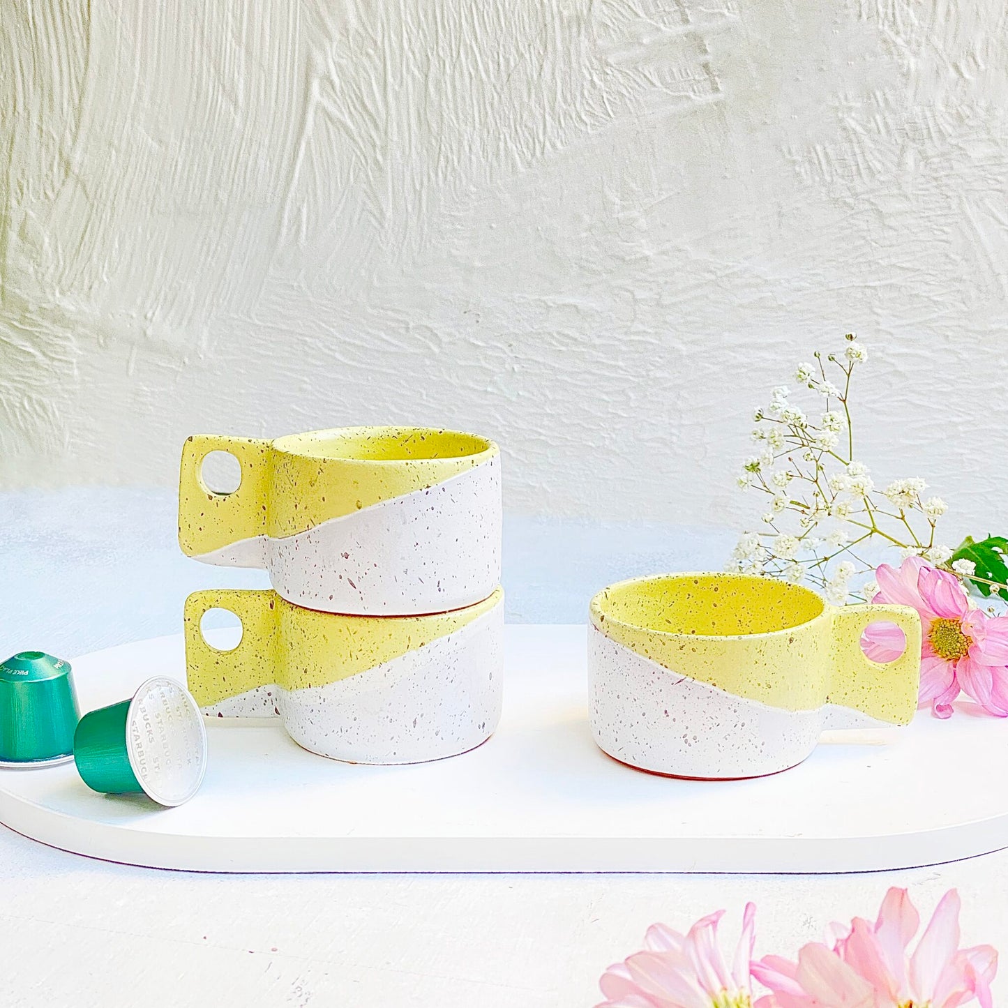 2 yellow espresso cups