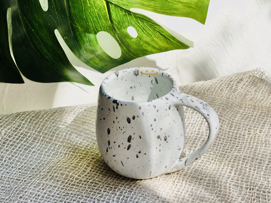 White bow mug with black dots
